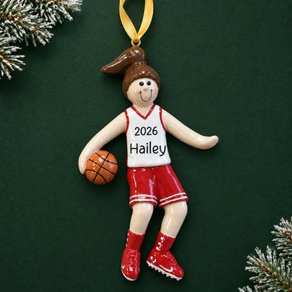 Personalized basketball girl christmas ornament on a dark green pine background