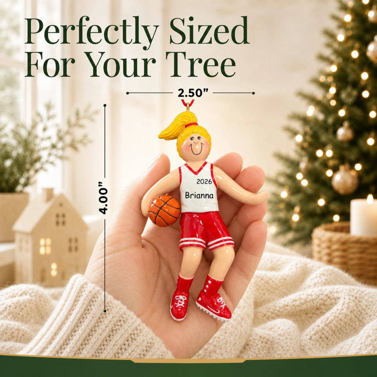 Size guide: the personalized blonde basketball girl christmas ornament is 2.50 in wide by 4.00 in tall, shown in hand