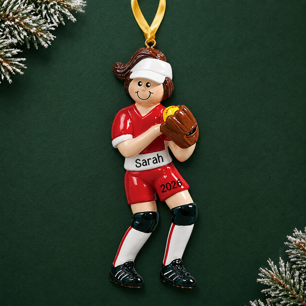 Personalized softball girl christmas ornament on a dark green pine background