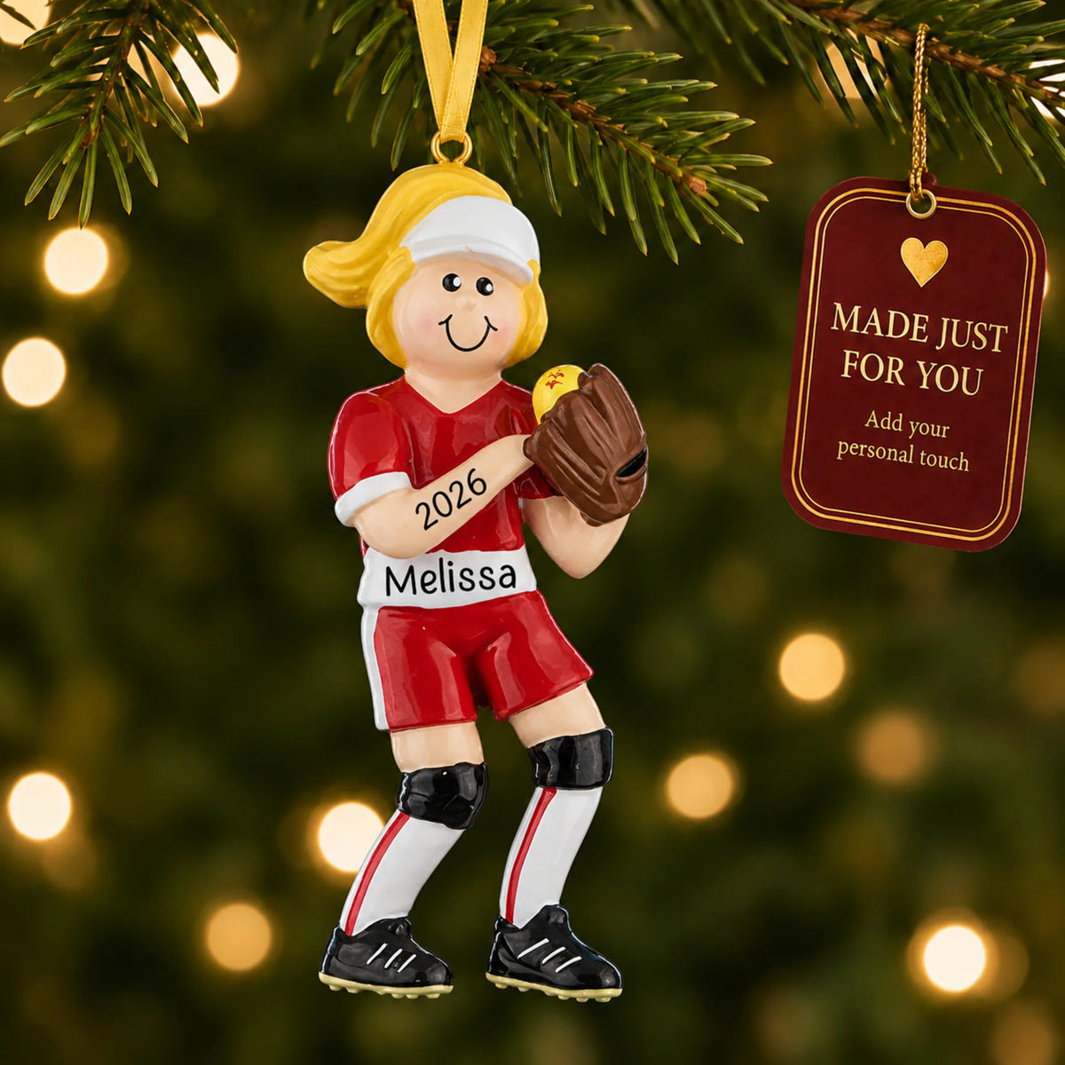 Blonde softball girl christmas ornament hanging on a lit Christmas tree with a Made Just For You gift tag