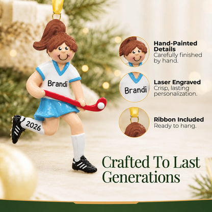 Hand-painted details and laser engraved personalization on the field hockey girl christmas ornament, ribbon included