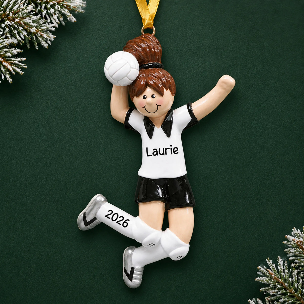 Personalized volleyball girl christmas ornament on a dark green pine background