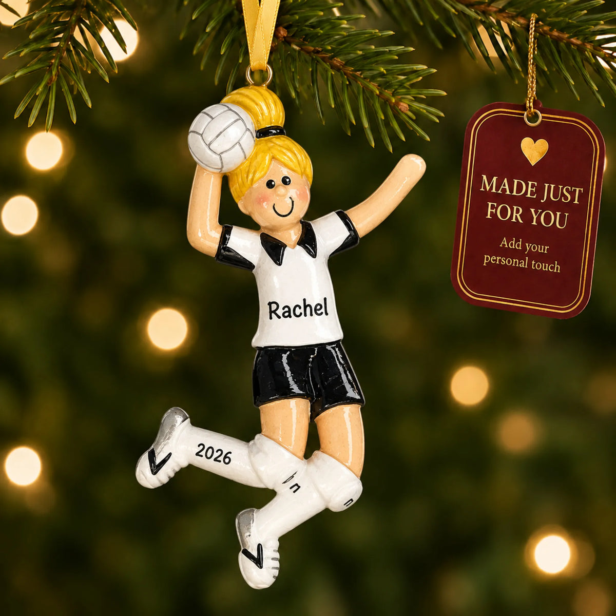 Blonde volleyball girl christmas ornament hanging on a lit Christmas tree with a Made Just For You gift tag