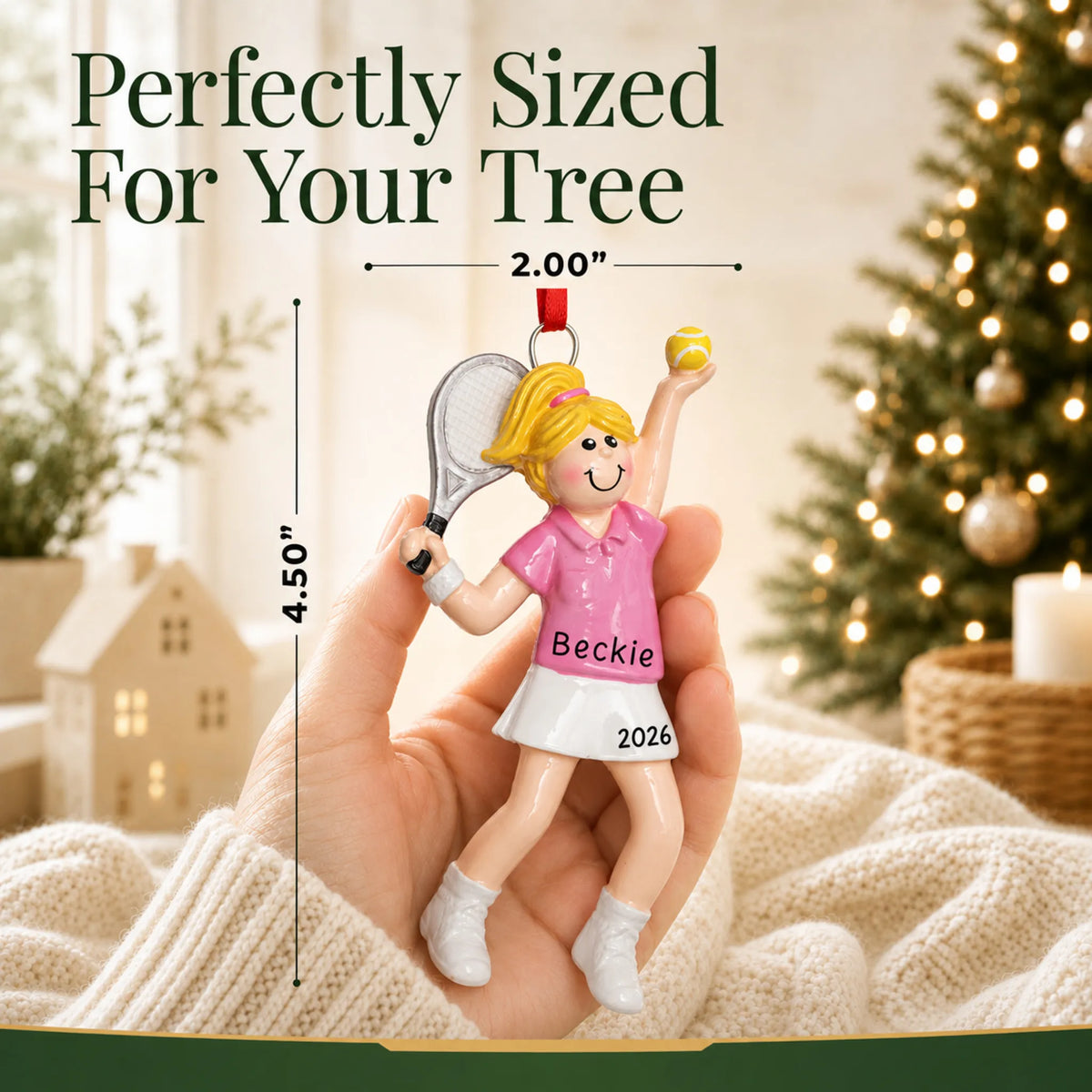Size guide: the personalized blonde tennis girl christmas ornament shown in hand next to a Christmas tree