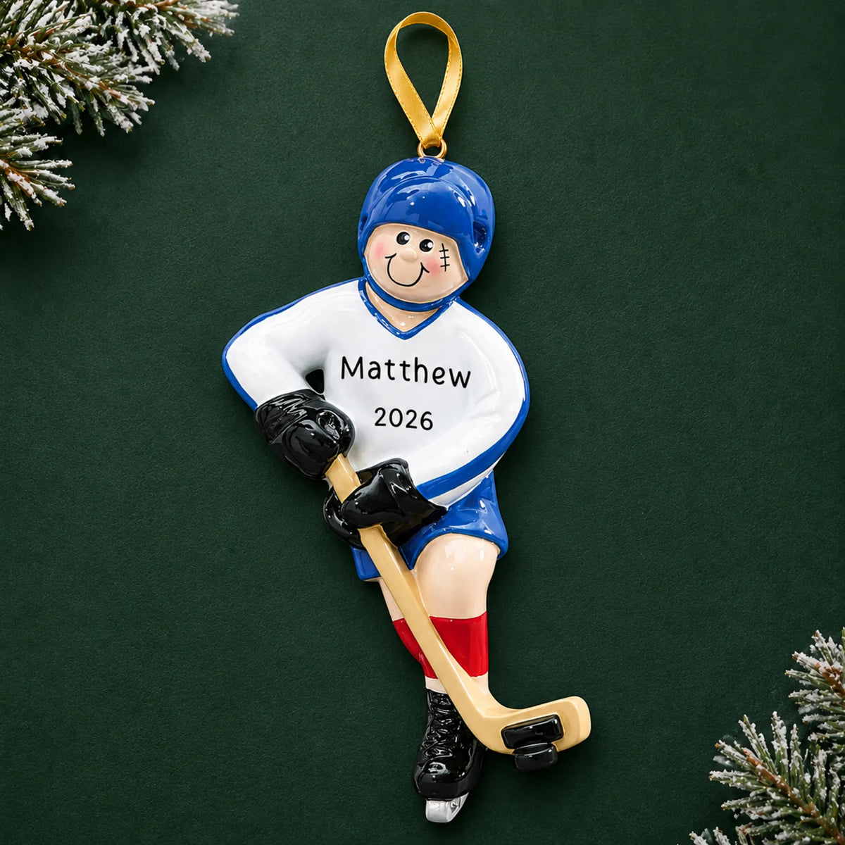 Personalized ice hockey boy christmas ornament on a dark green pine background