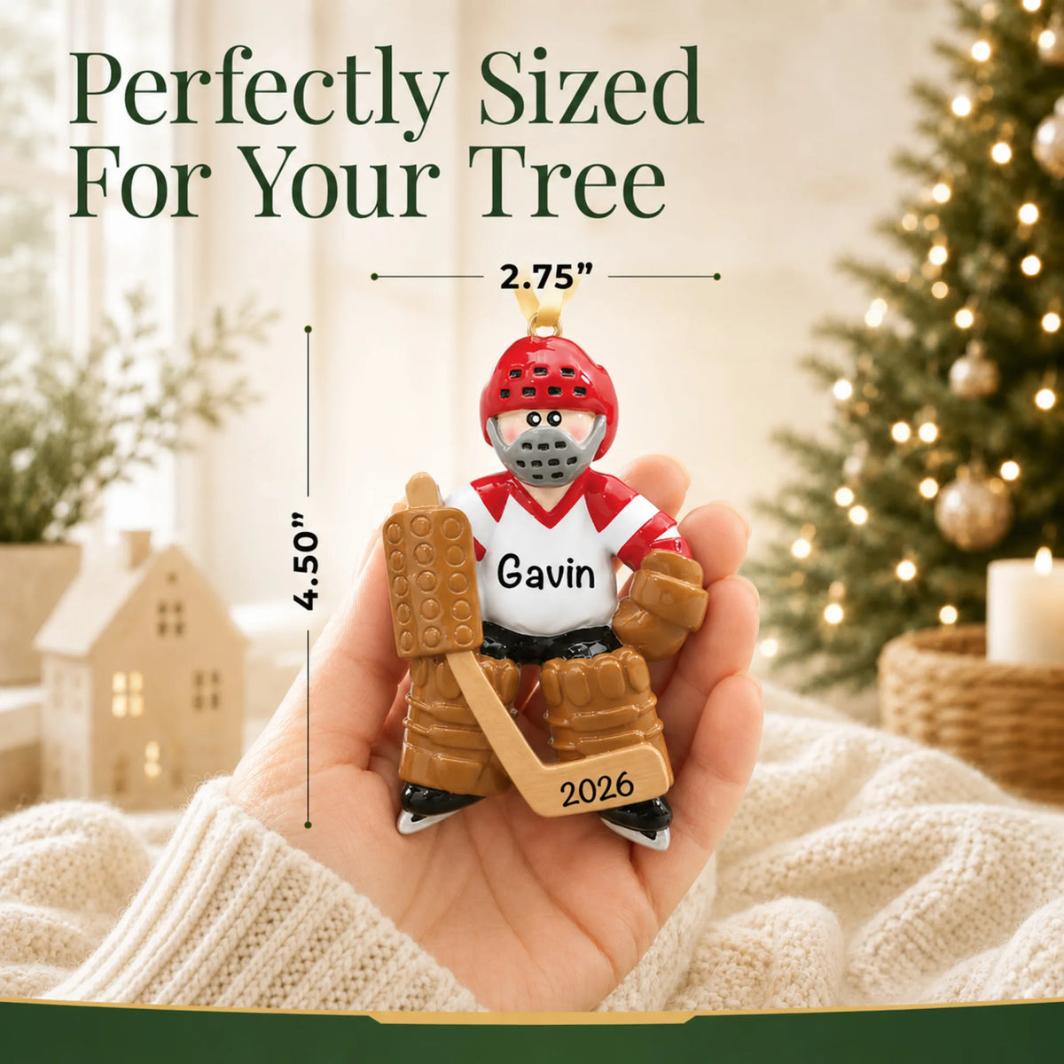 Size guide: the personalized ice hockey goalie christmas ornament is 2.75 in wide by 4.50 in tall, shown in hand