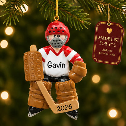 Ice hockey goalie christmas ornament hanging on a lit Christmas tree with a Made Just For You gift tag