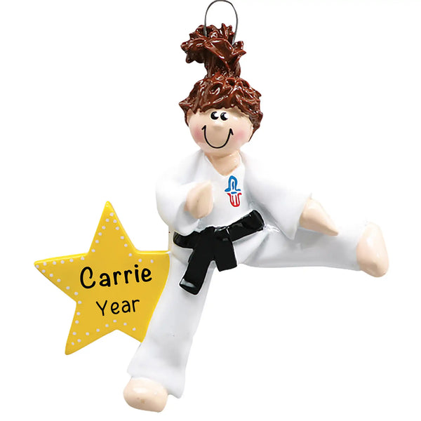 Personalized Christmas ornament featuring a girl in a white gi and black belt performing a kick next to a large yellow star, with the star ready for custom name and year engraving.