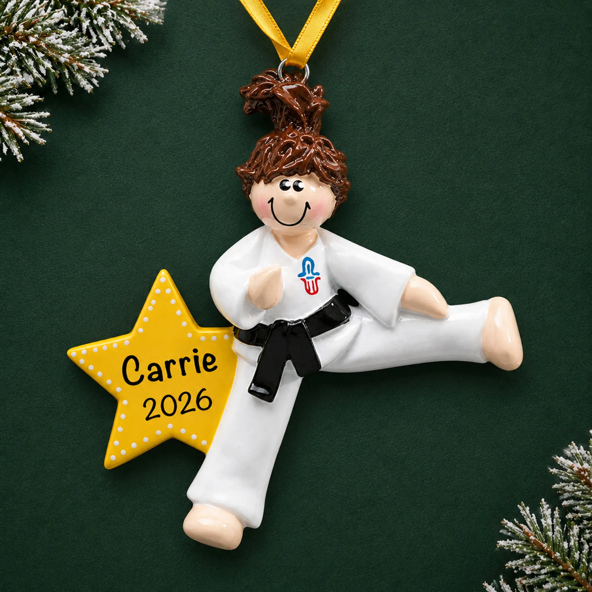 Personalized karate girl christmas ornament on a dark green pine background