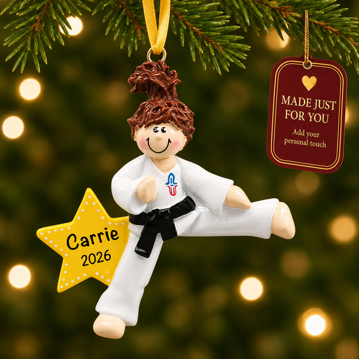 Karate girl christmas ornament hanging on a lit Christmas tree with a Made Just For You gift tag