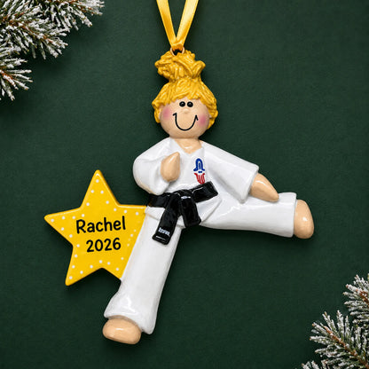 Personalized blonde karate girl christmas ornament on a dark green pine background