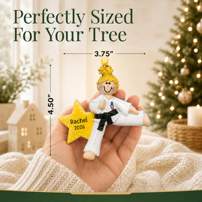Size guide: the personalized blonde karate girl christmas ornament is 3.75 in wide by 4.50 in tall, shown in hand
