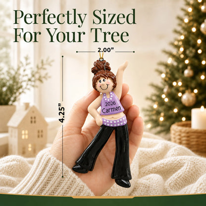 Size guide: the personalized brunette dance girl christmas ornament is 2.00 in wide by 4.25 in tall, shown in hand