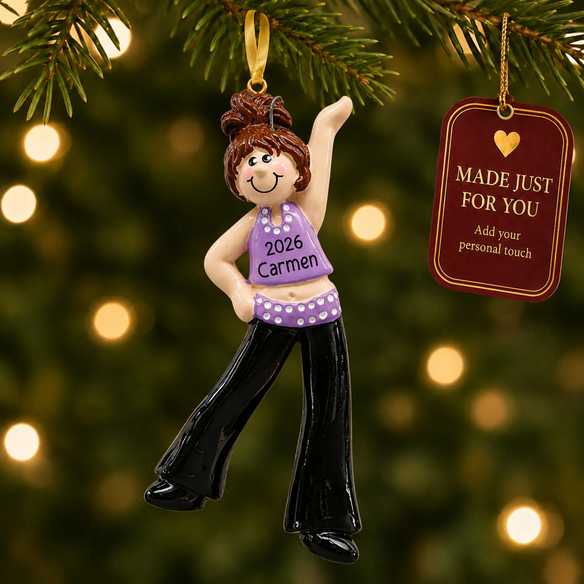 Brunette dance girl christmas ornament hanging on a lit Christmas tree with a Made Just For You gift tag