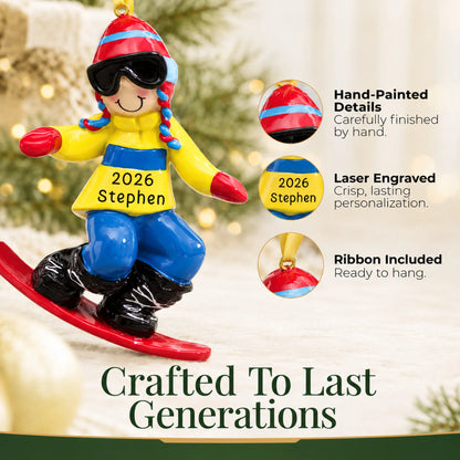 Hand-painted details and laser engraved personalization on the snowboard guy christmas ornament, ribbon included