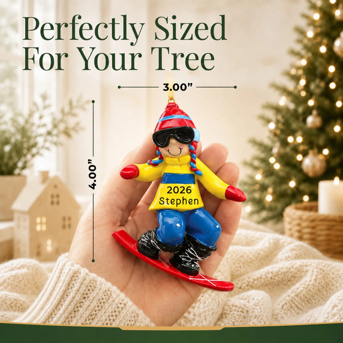 Size guide: the personalized snowboard guy christmas ornament shown in hand next to a Christmas tree