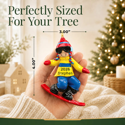 Size guide: the personalized snowboard guy christmas ornament shown in hand next to a Christmas tree