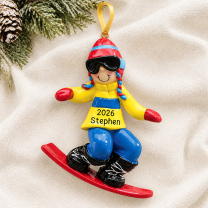 Personalized snowboard guy christmas ornament laid on a soft white knit blanket