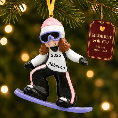 Snowboarding girl christmas ornament hanging on a lit Christmas tree with a Made Just For You gift tag