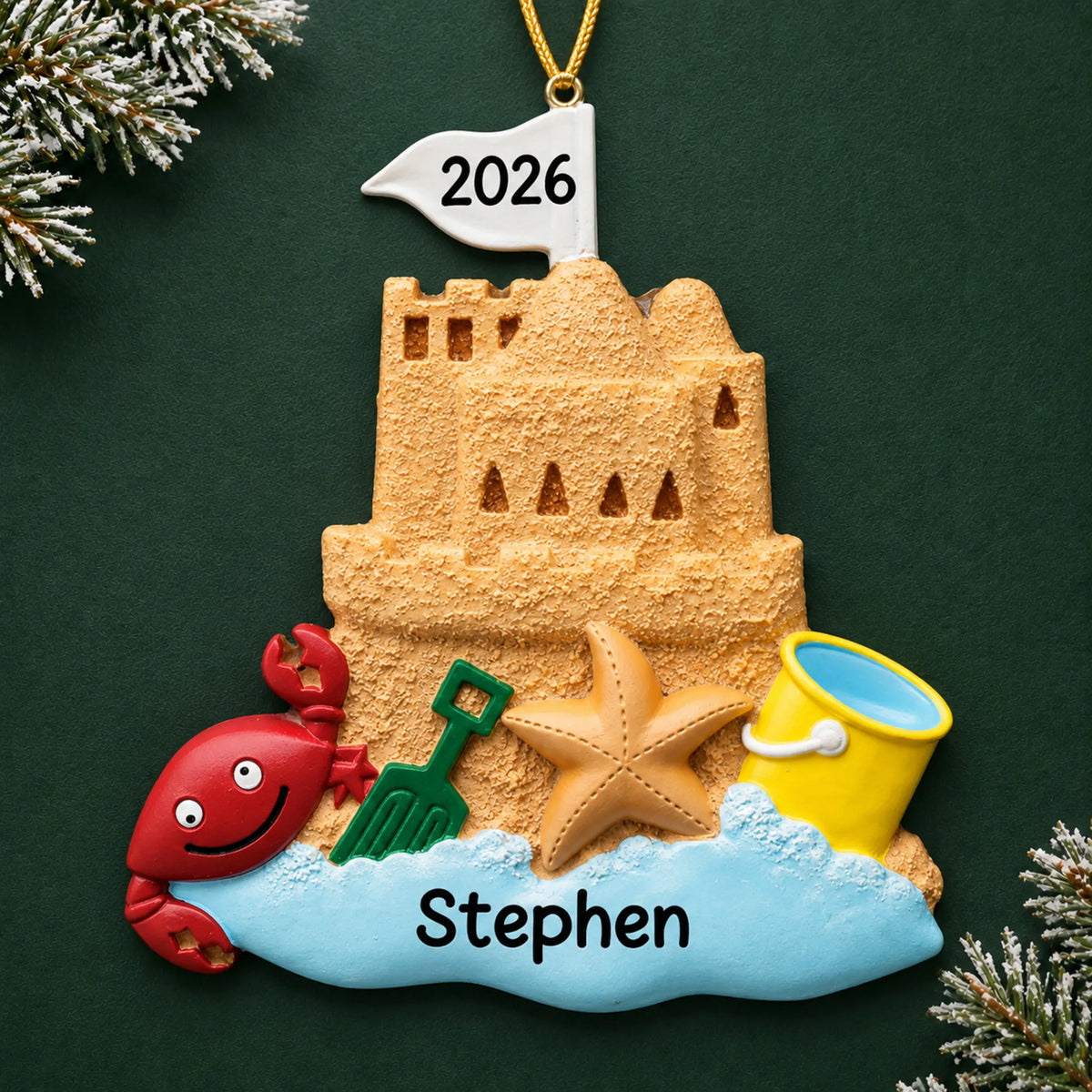 Personalized sand castle beach christmas ornament on a dark green pine background