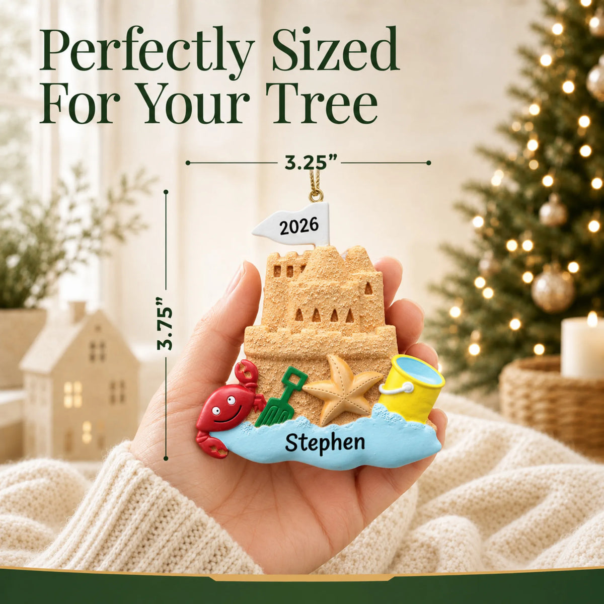 Size guide: the personalized sand castle beach christmas ornament is 3.25 in wide by 3.75 in tall, shown in hand