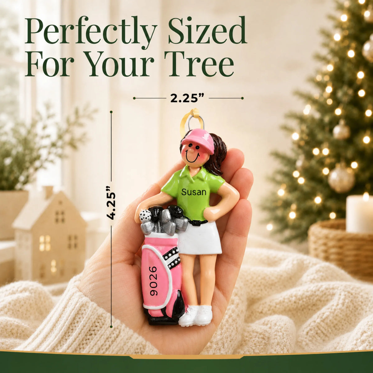Size guide: the personalized girl golfer christmas ornament is 2.25 in wide by 4.25 in tall, shown in hand