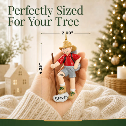Size guide: the personalized Hiker christmas ornament is 2.50 in wide by 4.50 in tall, shown in hand