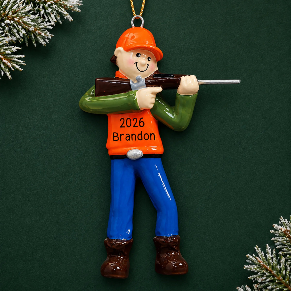 Personalized deer hunter christmas ornament on a dark green pine background