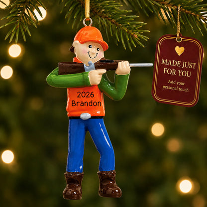 Deer hunter christmas ornament hanging on a lit Christmas tree with a Made Just For You gift tag