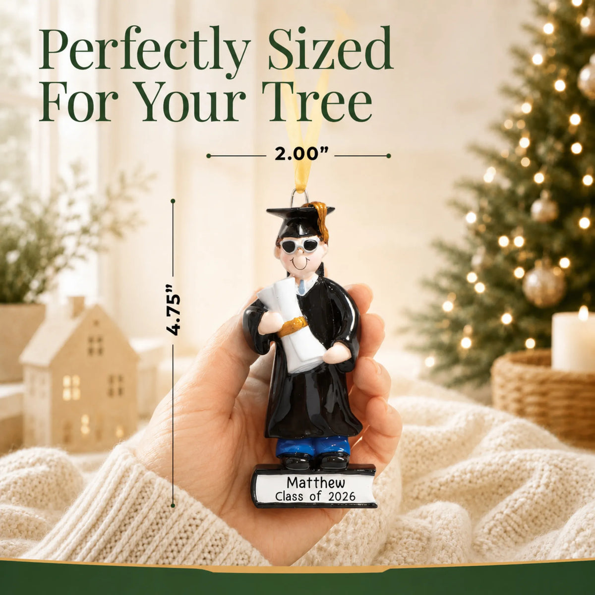 Personalized graduation guy Christmas ornament held in hand, sized about 2 inches wide and 4.75 inches tall for the tree