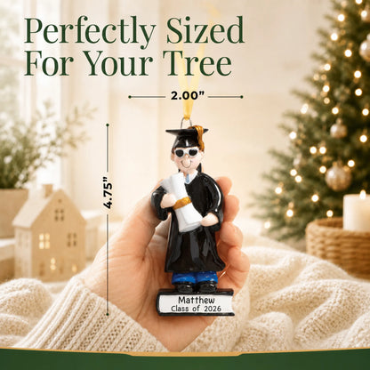Personalized graduation guy Christmas ornament held in hand, sized about 2 inches wide and 4.75 inches tall for the tree