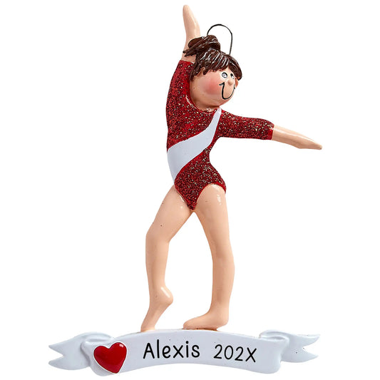 A personalized holiday ornament featuring a gymnast in a red and white leotard on a beam, with the text 'ALEXIS YEAR' at the base.