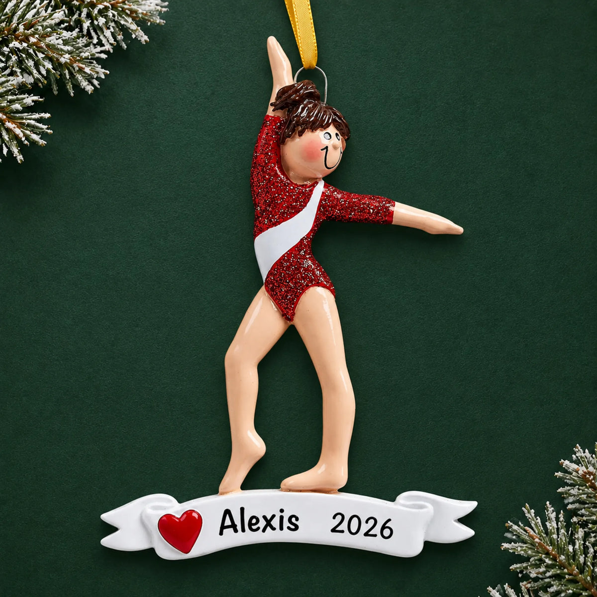 Personalized red leotard gymnast christmas ornament on a dark green pine background