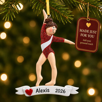 Red leotard gymnast christmas ornament hanging on a lit Christmas tree with a Made Just For You gift tag