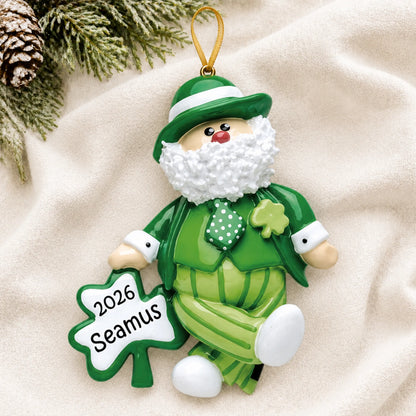 Personalized Irish Santa Christmas Leprechaun ornament laid on a soft white knit blanket
