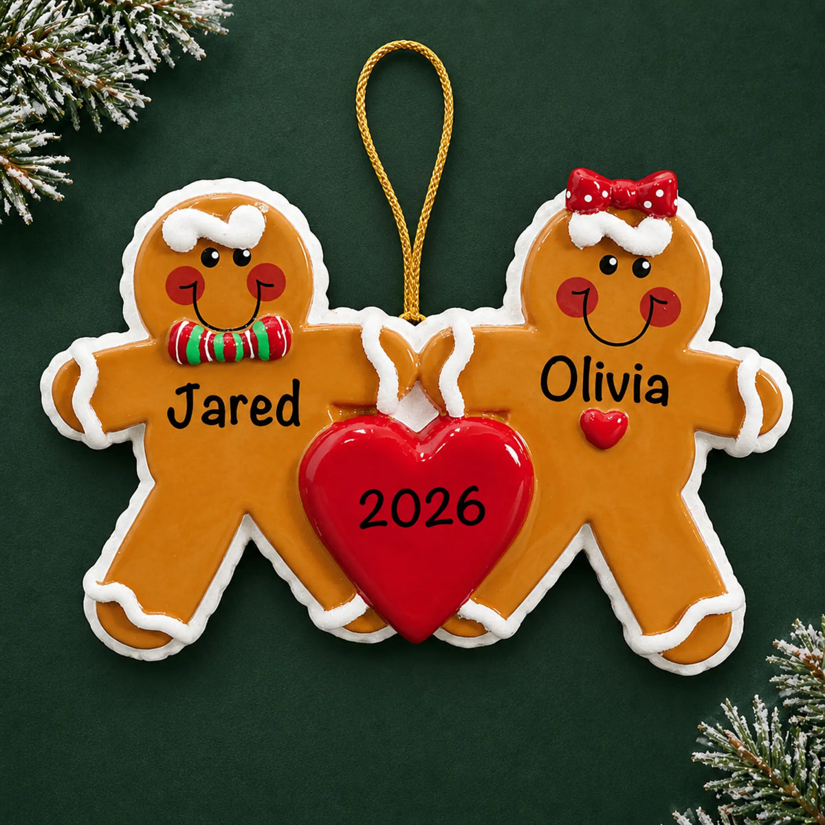 Personalized gingerbread love couple christmas ornament on a dark green pine background