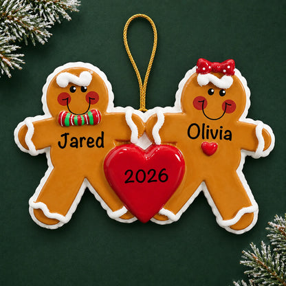 Personalized gingerbread love couple christmas ornament on a dark green pine background