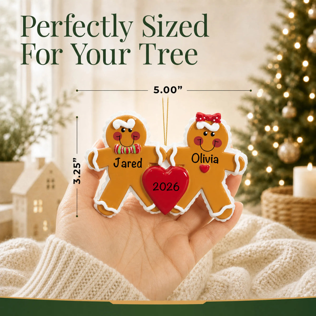 Size guide: the personalized gingerbread love couple christmas ornament is 5.00 in wide by 3.25 in tall, shown in hand