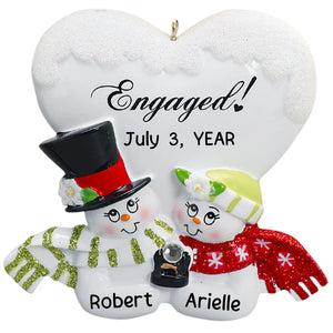 Personalized engaged snow couple Christmas ornament with two snowmen, an Engaged heart, and custom names and date