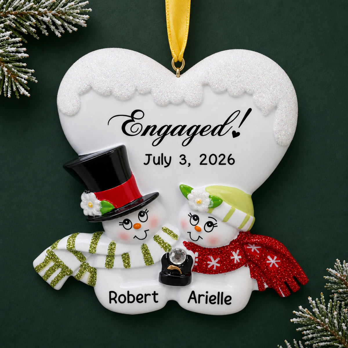 Personalized engaged snow couple Christmas ornament with two snowmen under an Engaged! heart with names and date