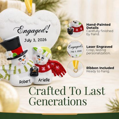 Close-up of the personalized engaged snow couple Christmas ornament: hand-painted detail, laser engraving