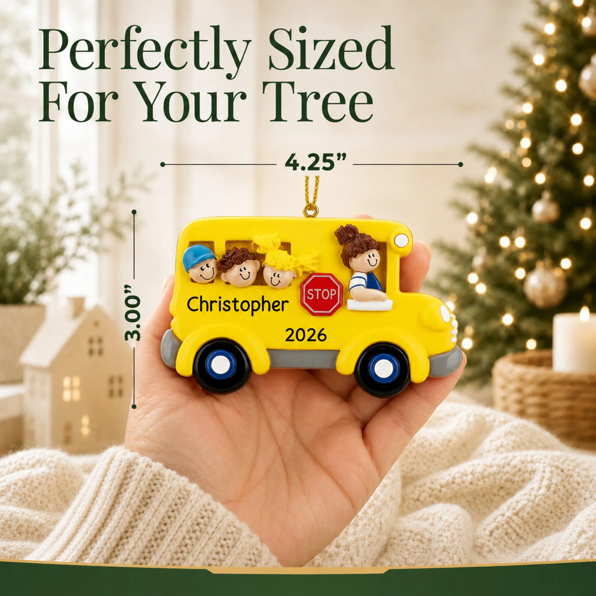 Personalized kids school bus Christmas ornament held in hand to show its size on the tree