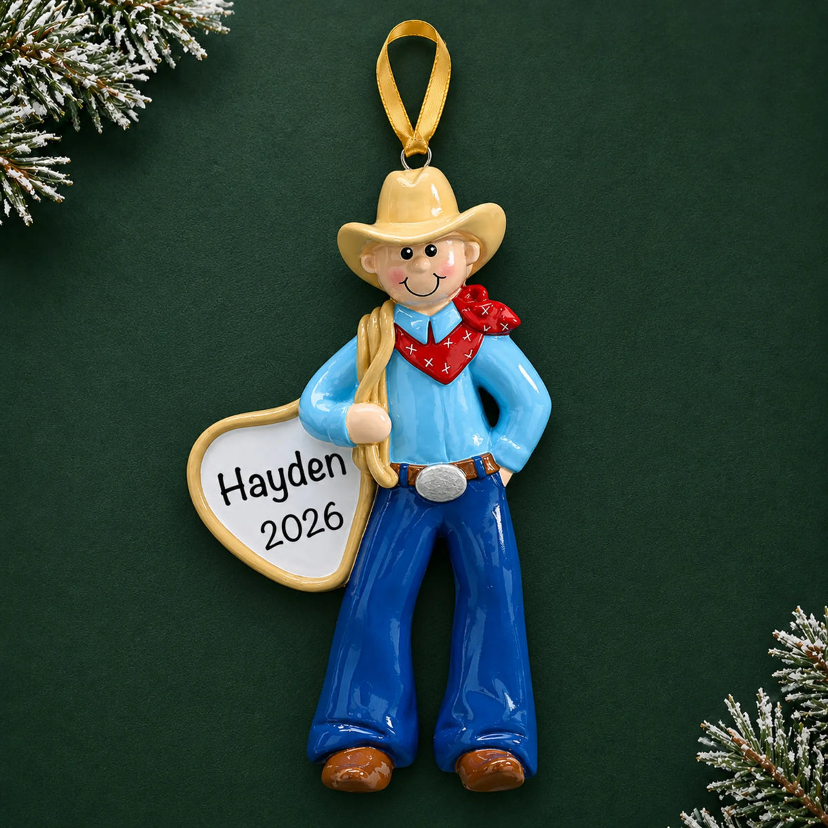 Personalized cowboy rodeo christmas ornament on a dark green pine background