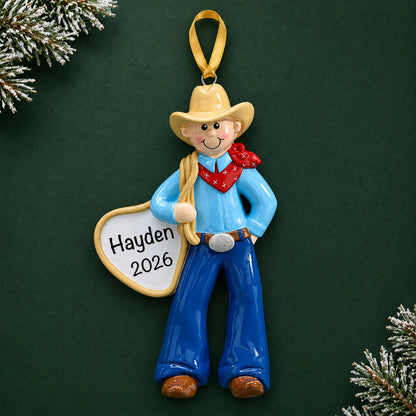 Personalized cowboy rodeo christmas ornament on a dark green pine background