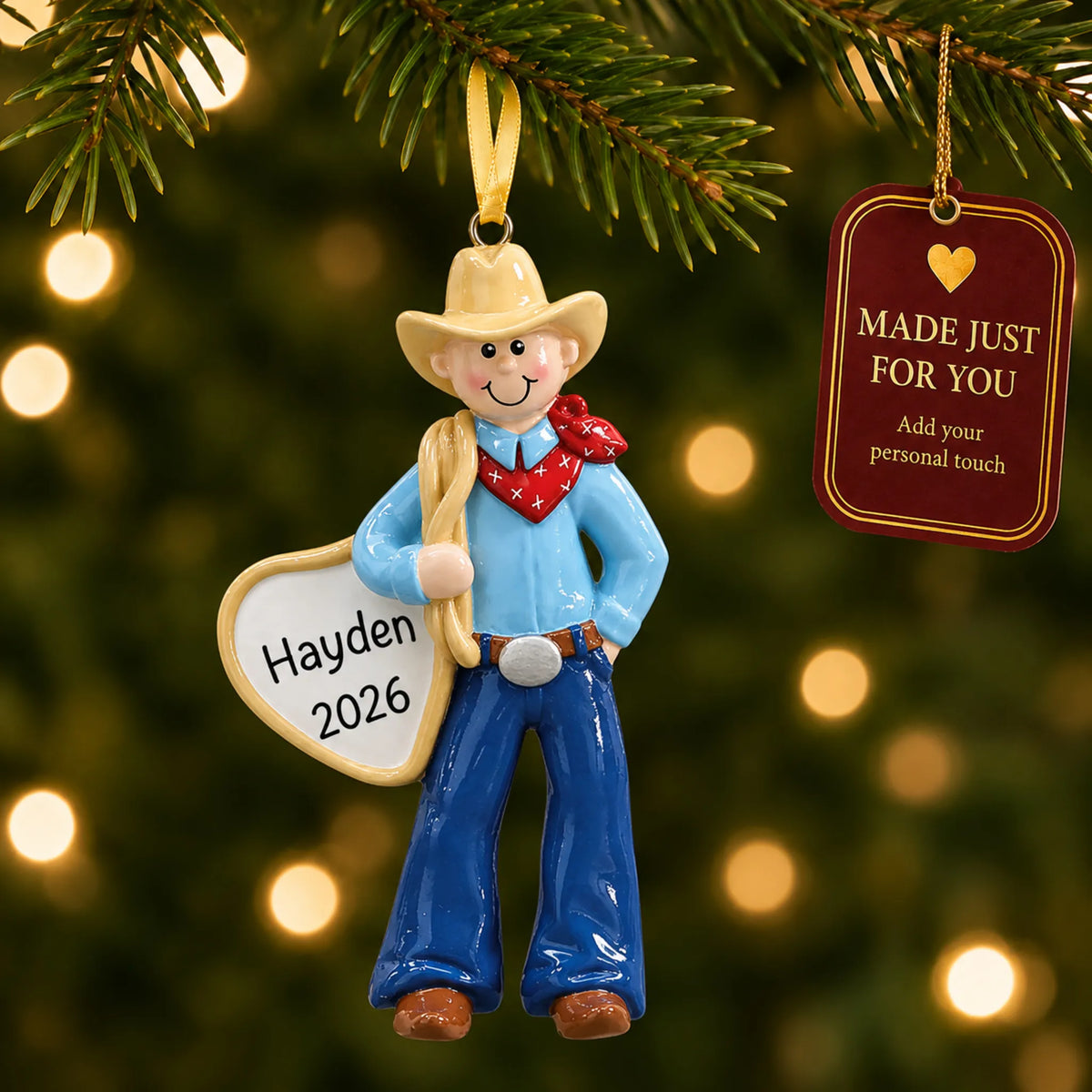 Cowboy rodeo christmas ornament hanging on a lit Christmas tree with a Made Just For You gift tag