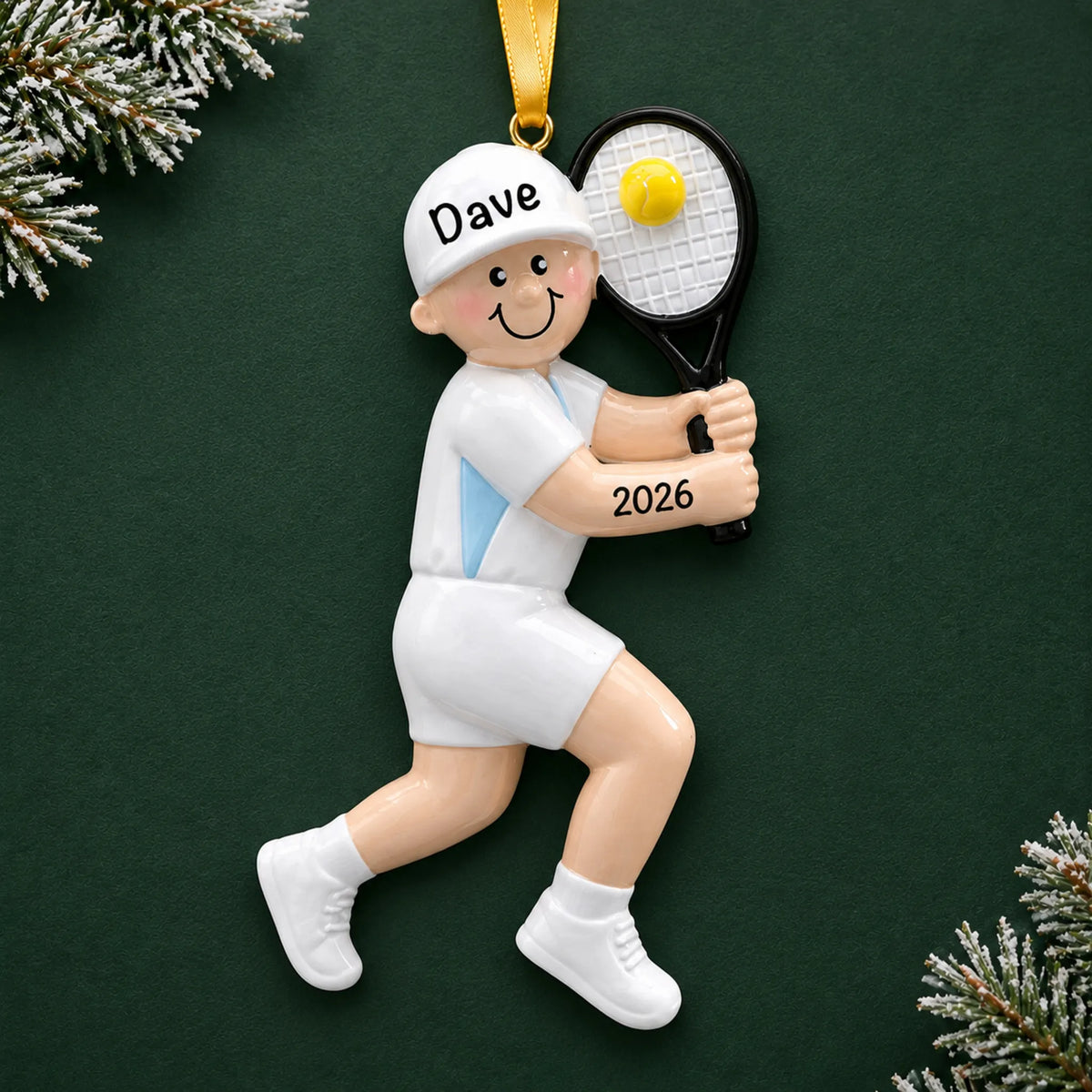 Personalized tennis guy christmas ornament on a dark green pine background
