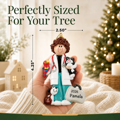 Size guide: the personalized veterinarian girl christmas ornament is 2.50 in wide by 4.25 in tall, shown in hand