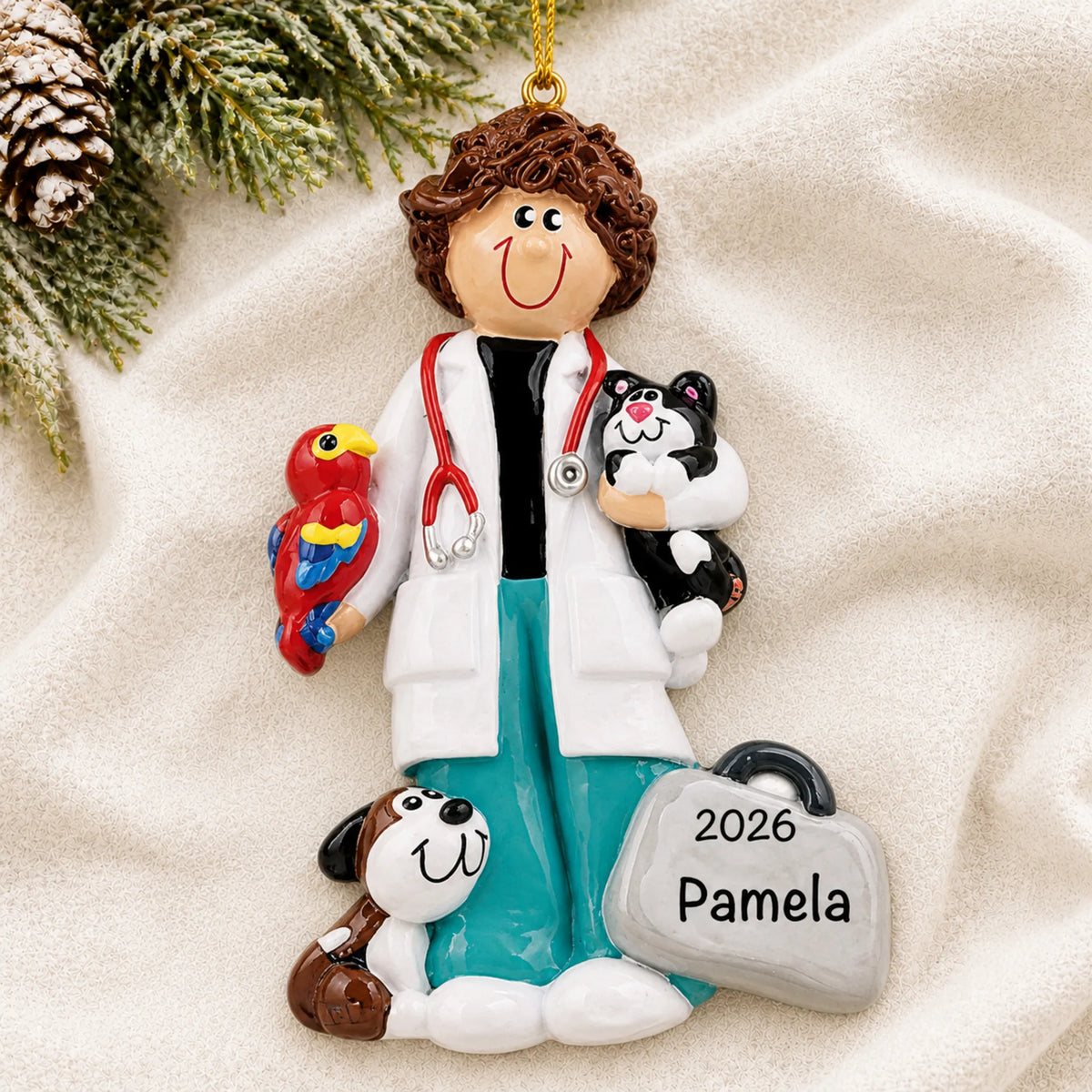 Personalized veterinarian girl christmas ornament laid on a soft white knit blanket