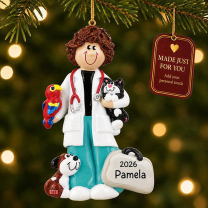 Veterinarian girl christmas ornament hanging on a lit Christmas tree with a Made Just For You gift tag