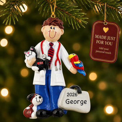 Veterinarian guy christmas ornament hanging on a lit Christmas tree with a Made Just For You gift tag